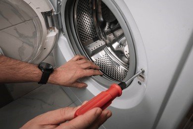 technician-repairing-washing-machine-man-260nw-2472179951